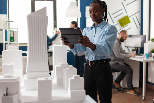 istock African american architect woman working on tablet 1491042598