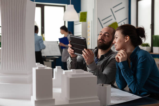istock Design architecture colleagues sitting at office 1491042624