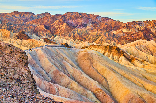 Image of Ripples of color cover eroded mountains in Death Valley iconic Zabriskie Point