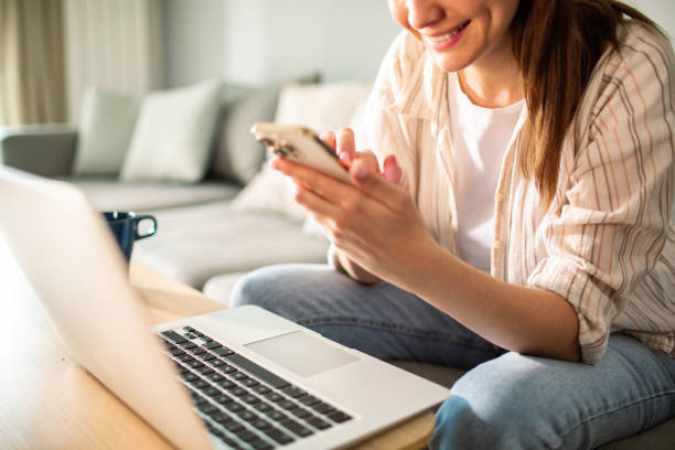 istock Young woman using a smart phone at home 1491043667