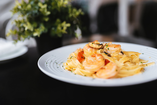 Tagliatelle with Mixed Raw Seafood. Restaurant food.