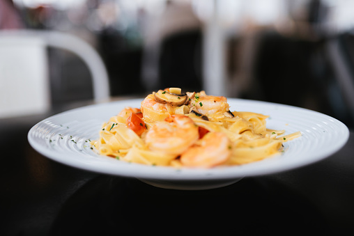 Tagliatelle with Mixed Raw Seafood. Restaurant food.