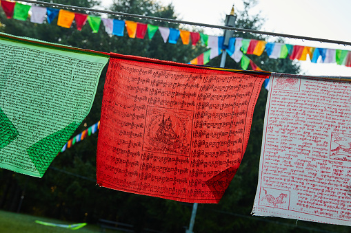 Rope with green, red, and white Tibetan Mongolian Buddhist prayer flags