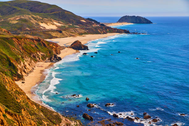 istock Sandy beaches and ocean waves on west coast with mountains 1491044423