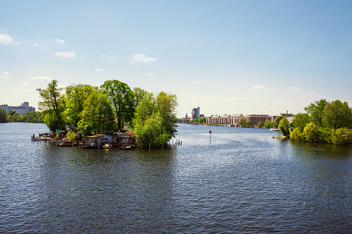 view from spandau bridge on island in the havel river in Berlin with the city of spandau in the background