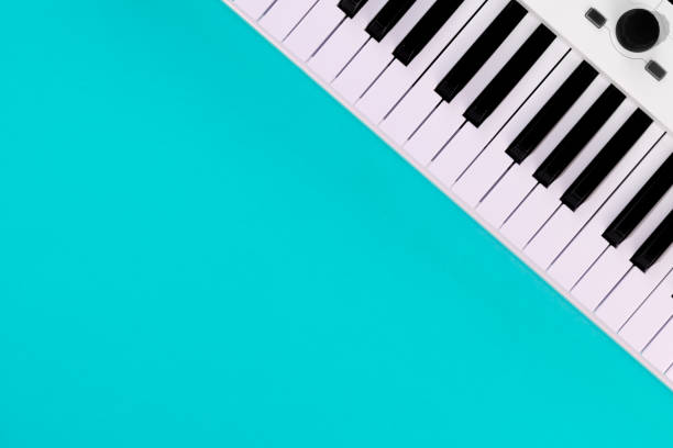 istock Piano keys on a blue background, top view, flat lay, copy space. 1491046180