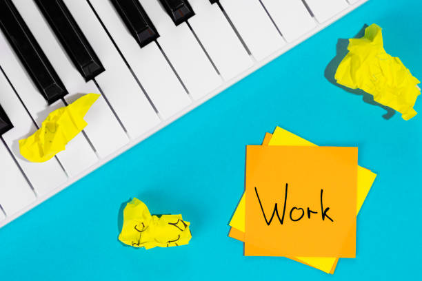 istock Piano and paper reminder with word Work on blue background. 1491046186