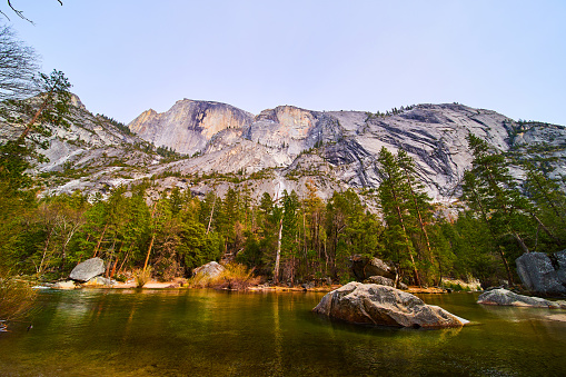 Image of Stunning cliffs of Half Dome by lake at Yosemite National Park