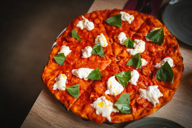 Pizza with burrata cheese and basil