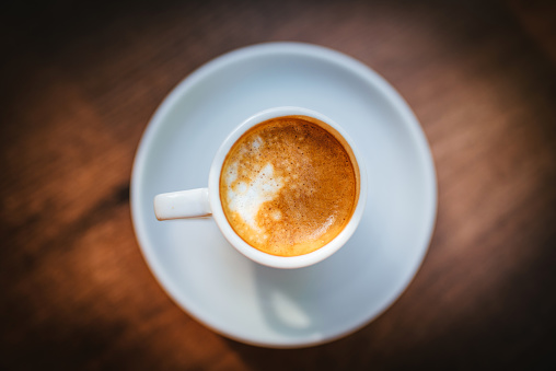 Espresso macchiato close up photo.