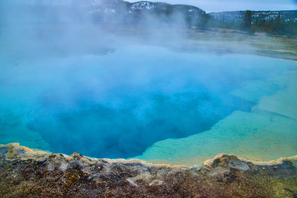 istock Sulfur steam rises off large deep blue pools in Yellowstone basin 1491048155