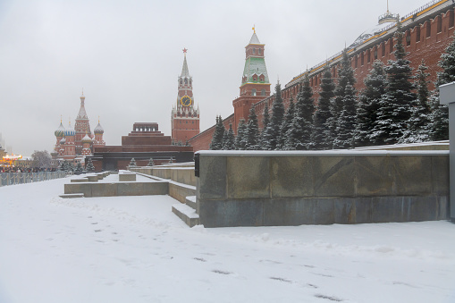Snow covered Red square by Moscow kremlin during Christmas.  Overcast sky. Soft focus. Winter holidays in Russia theme.