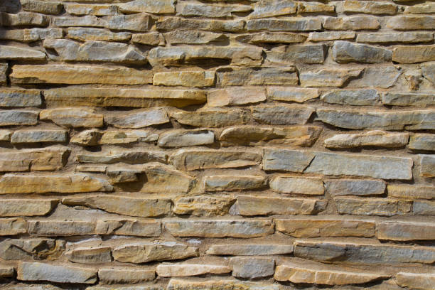 istock The stone wall texture background natural color. 1491049471