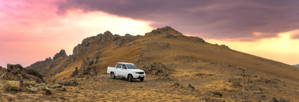 istock SUV stands in a mountainous area 1491049592