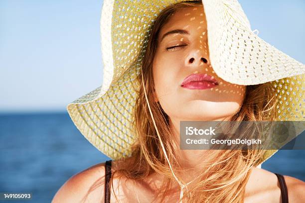 Beautiful Woman On A Beach Stock Photo - Download Image Now - Human Face, Sunlight, Women