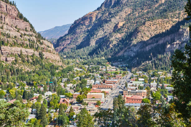 istock View of small town main road and completely surrounded by mountains 1491054297