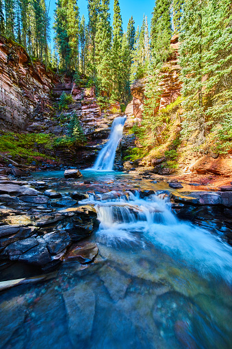 Image of Waterfalls in colorful canyon with sunlight