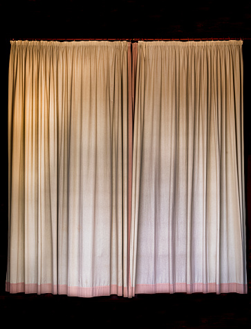 old curtain on a black background