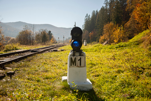 Old traffic light for trains in the mountains.