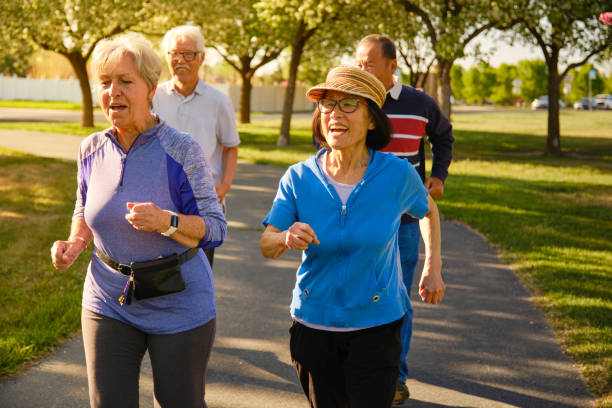 istock Group of Senior Aged People Power Walking in a Park 1491063729