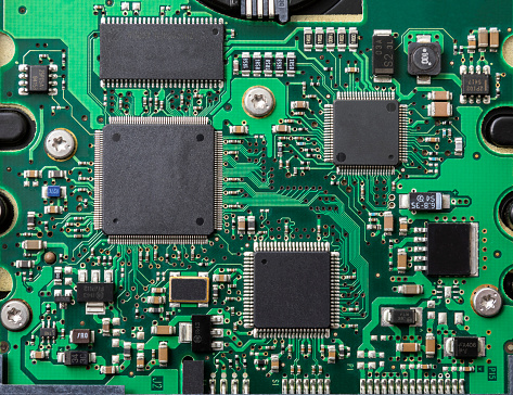 Macro Close up of components and microchips on PC circuit board of Hard Disc Drive
