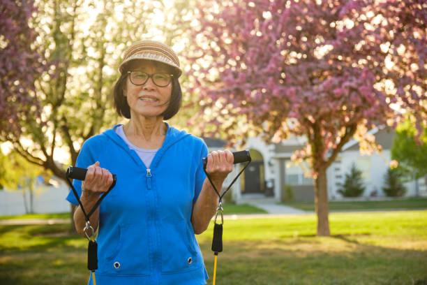 istock Senior Aged Woman Exercising in a Park 1491064586