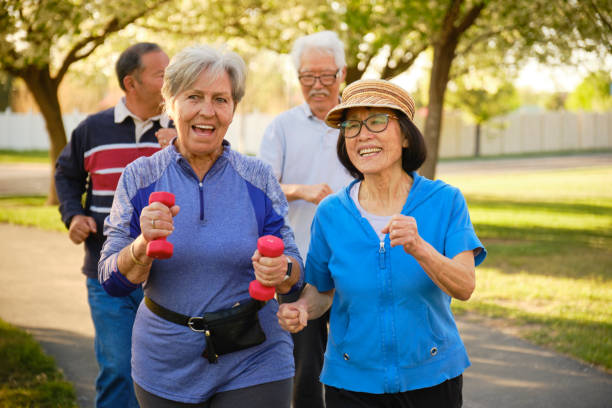 istock Group of Senior Aged People Power Walking in a Park 1491064703