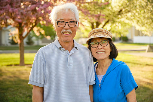 A senior aged couple spending time together in a park.