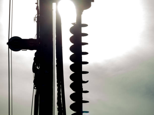A Close-up Silhouette of Excavator hydraulic drilling machine at a Construction site.