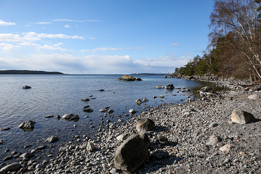 Beautiful Sweden city Nynäshamn
rock cliff seaside archipelago shore view with Baltic Sea clear sky. Blue clear sky.