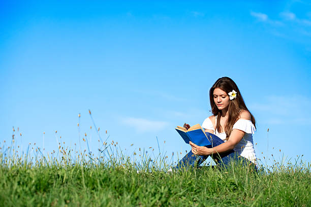 istock Pretty smiling girl relaxing outdoor 149106900