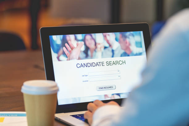 istock Businessman looking at recruitment website on a laptop computer 1491070292