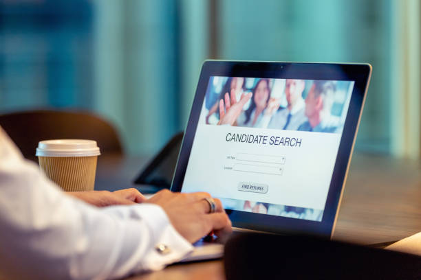 istock Businessman looking at recruitment website on a laptop computer. 1491070348