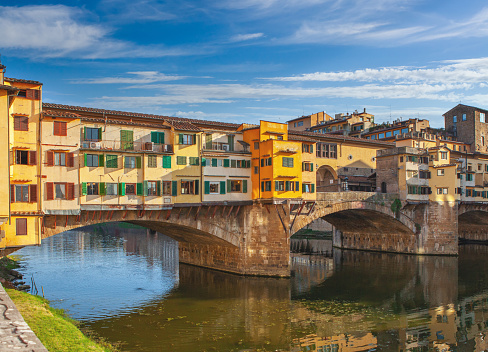 Long exposure photo of Florence old bridge and arno river