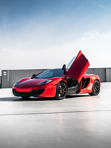 Seattle, WA, USA\nMay 17, 2023\nMclaren MP4-12C showing the drivers door open with a wall in the background