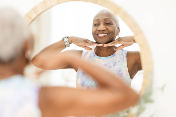 istock Senior Black Woman Massaging Face 1491090628