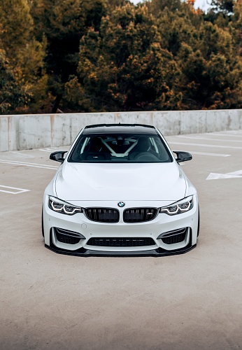 Seattle, WA, USA
May 17, 2023
BMW M4 parked showing the front bumper with trees in the background