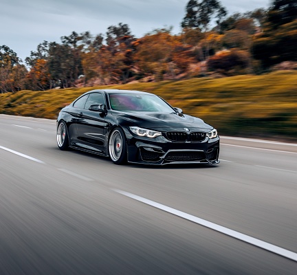 Seattle, WA, USA\nMay 17, 2023\nBlack BMW M4 driving on the road