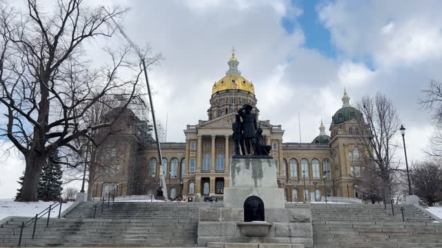 Side Trucking Shot of Driving Past the Iowa State Capitol (Under Construction) in Des Moines on a Snowy Day