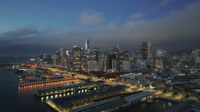 San Francisco skyline downtown with business building skyscraper and waterfront at twilight in California, USA.