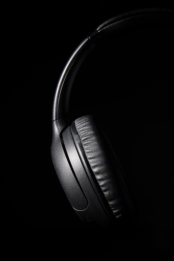 Still life photo of black headphones shot in low key lighting.