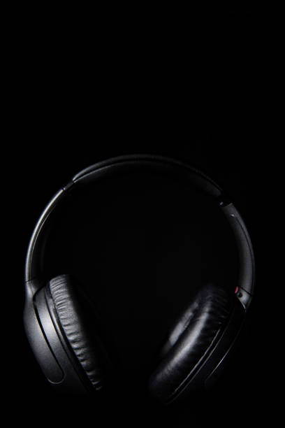 istock Black headphones on a dark background 1491094526