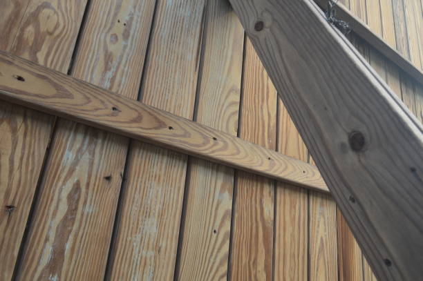 istock selective focus , Low angle view of futuristic architecture, wooden villa, construction one corner of wooden wall getting direct sunlight. 1491095743