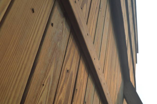 istock selective focus , Low angle view of futuristic architecture, wooden villa, construction one corner of wooden wall getting direct sunlight. 1491095756