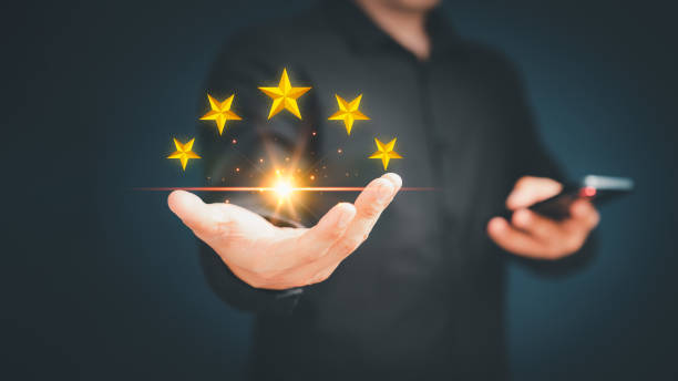 istock Customer or client man hand showing the stars icon to complete five stars. Assessment customer service giving the five star rating, service feedback, satisfaction and testimonial concept. 1491103122