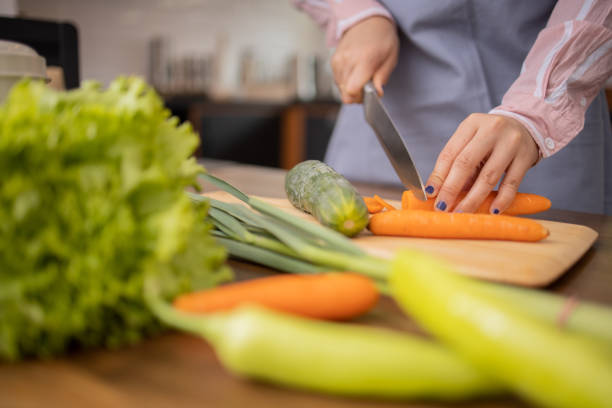 istock Young woman is preparing a meal 1491103258