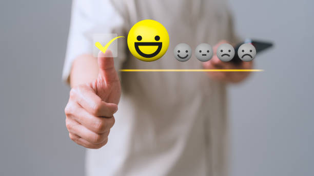 istock Customer service testimonial and satisfaction concept. Man client touching the virtual screen on the happy smile face icon to assessment satisfaction in service. Rating opinion very impressed. 1491105946