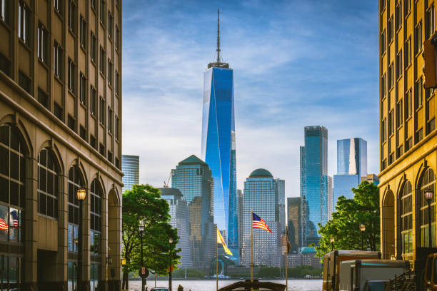 Freedom Tower with American Flag in the Foreground stock photo