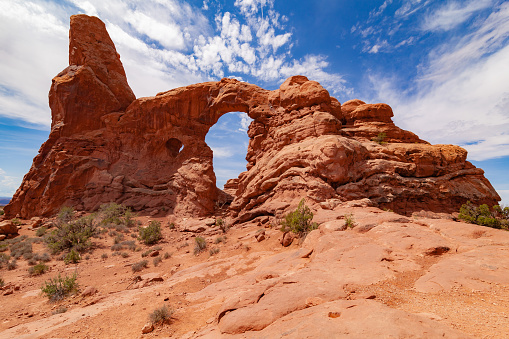 Time with the help of the sun, rain and wind, has shaped this boulder making it unique. Arches National Park is a national park in eastern Utah in the United States. The park is adjacent to the Colorado River 4 miles (6 km) north of Moab, Utah.