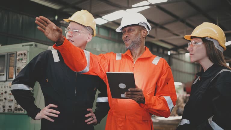 Heavy Industry Engineers consult in Factory.